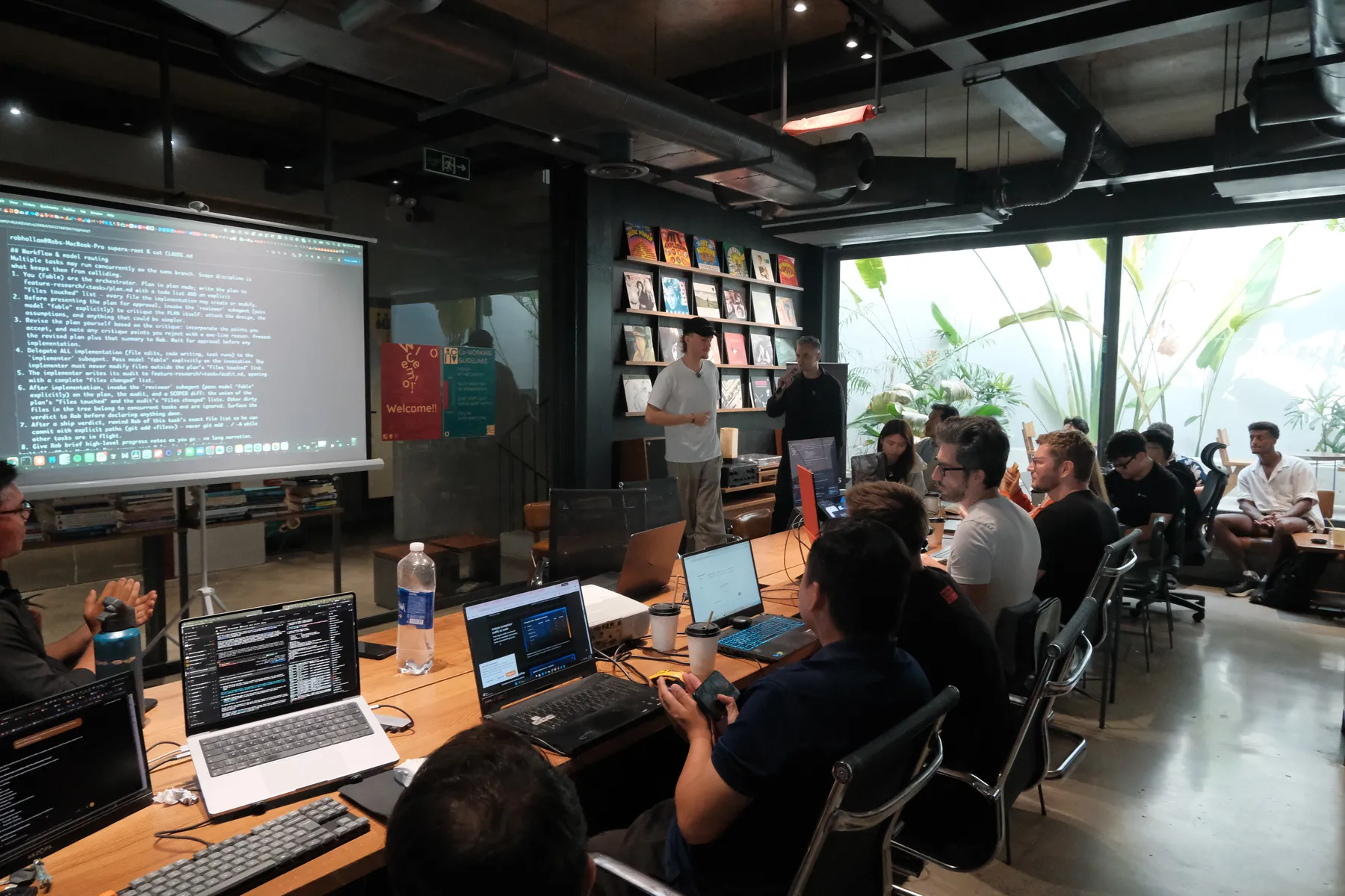 An AI workflow walkthrough on screen during the Frontier Club AI Meetup